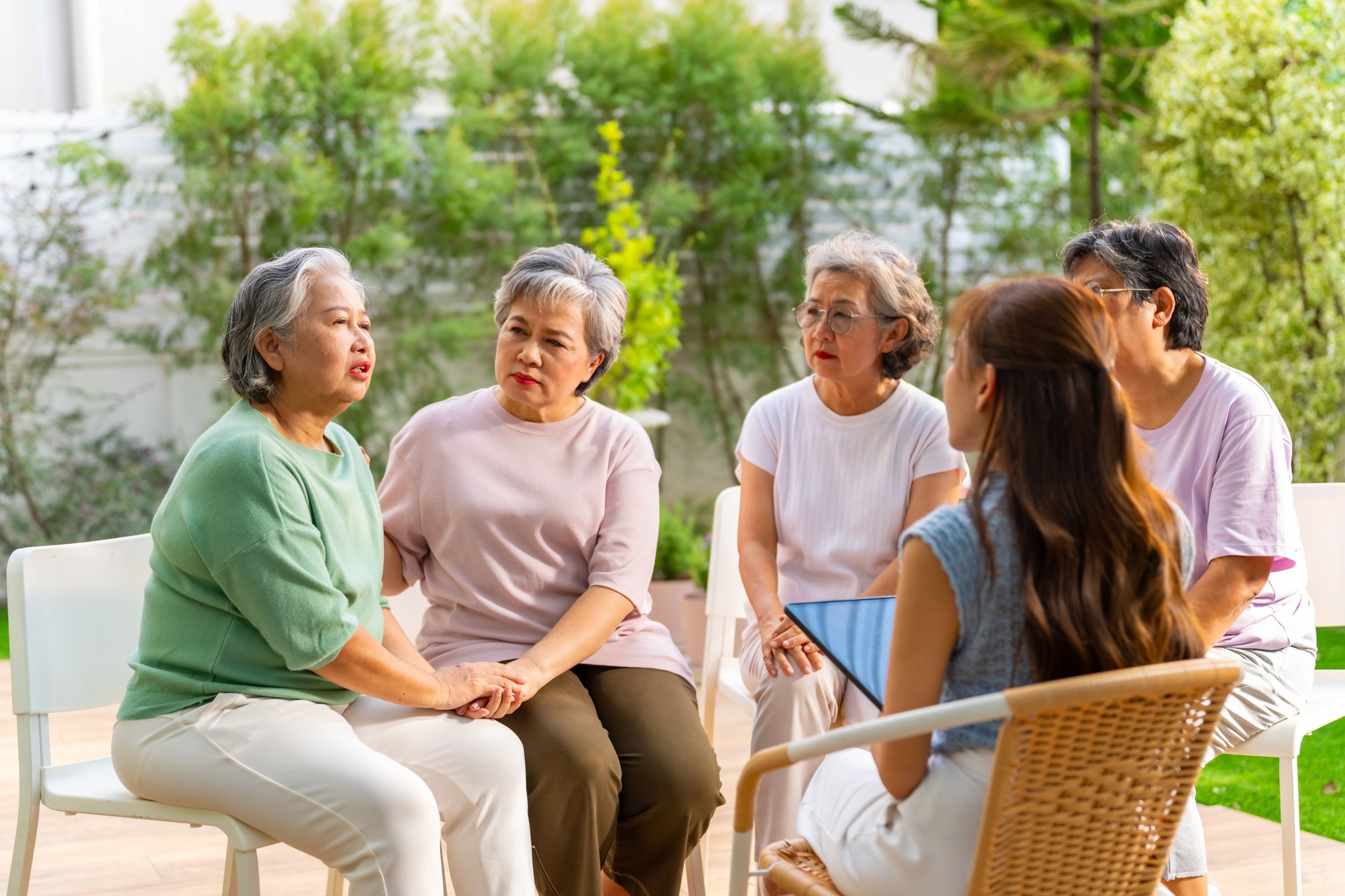 Group of Asian elderly woman meeting with psychiatrist.